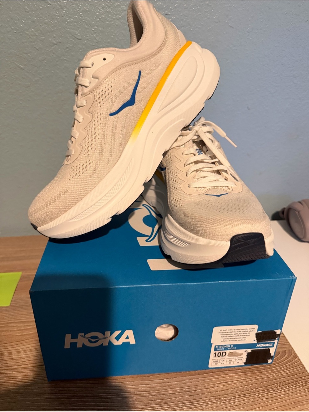 Hoka Men's Running Shoes in Cream with Blue & Yellow Accents